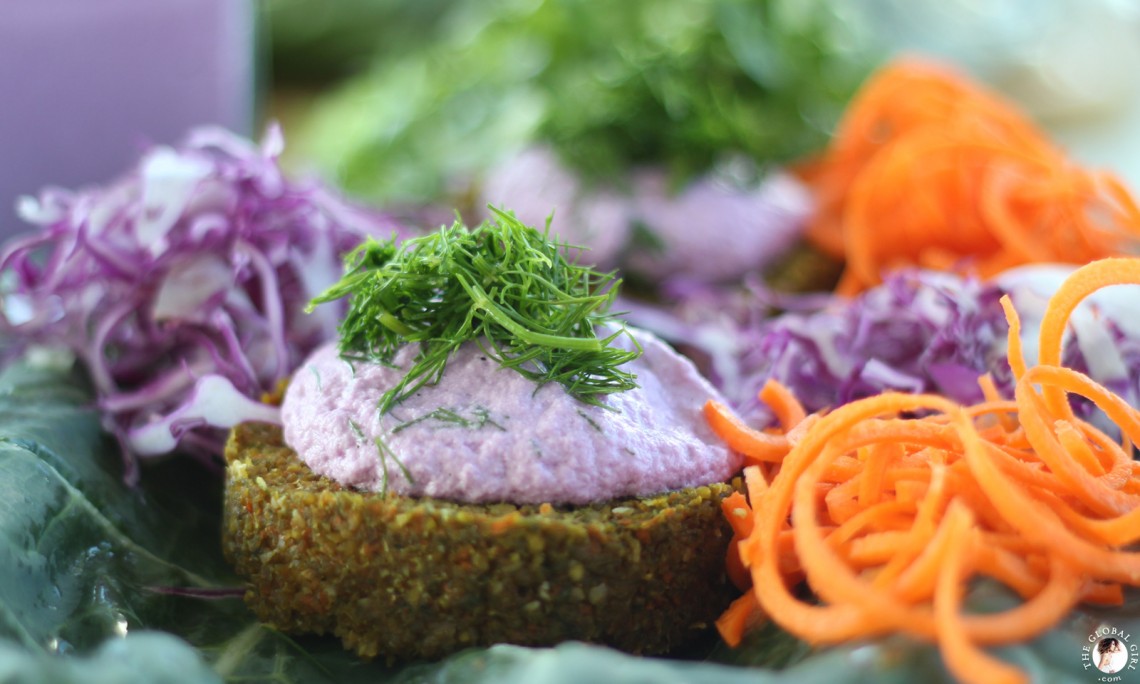 The Global Girl Raw Food Recipes: Carrot & Dill Burgers in collard green leaf with shredded red cabbage, romaine lettuce and carrots. 100% raw, vegan and gluten-free.