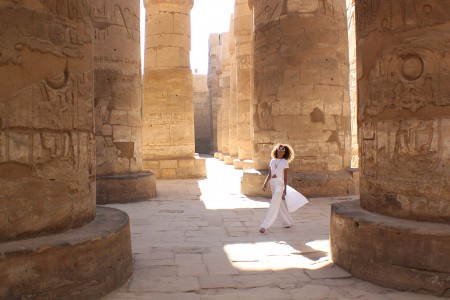The Global Girl Daily Style: Ndoema sports the all white look at the Karnak Temple in Luxor, Egypt.