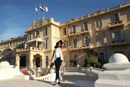 The Global Girl Travels: Ndoema sports a classic black and white hat look at the Sofitel Winter Palace Hotel in Luxor, Egypt.