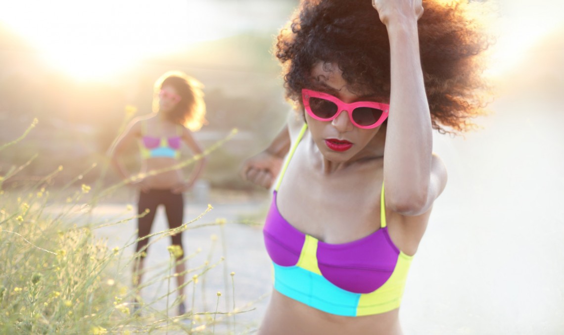 The Global Girl Daily Style: Ndoema jogs in pink cat eye sunglasses and a color block sports bra by Onzie