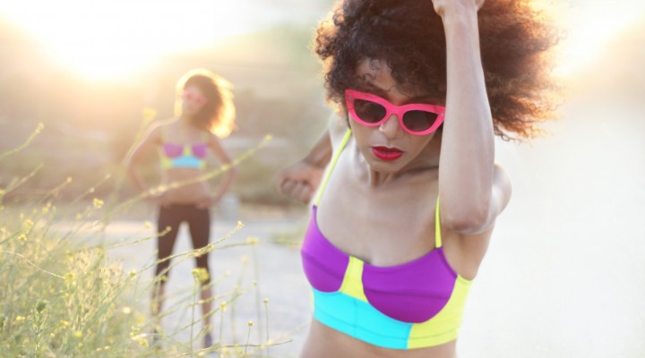 The Global Girl Daily Style: Ndoema jogs in pink cat eye sunglasses and a color block sports bra by Onzie