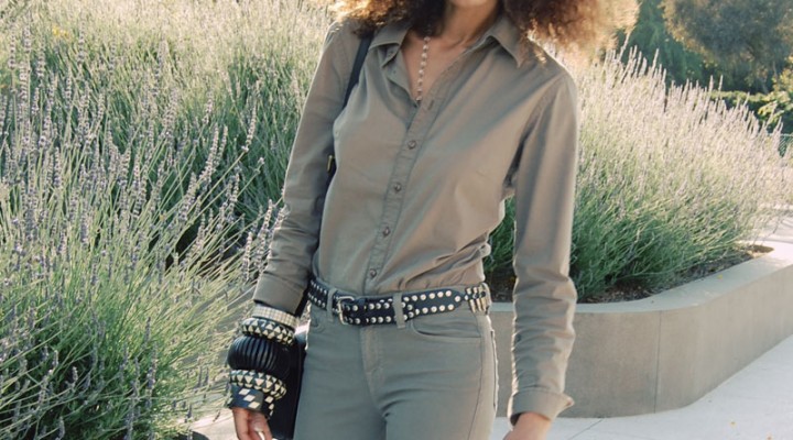 Ndoema wears J Brand jeans in khaki, G-Star Raw Denim shirt, l.a.m.b. platform sandals, classic dooney bourke leather handbag and large ethnic black and white horn and wood bracelets.