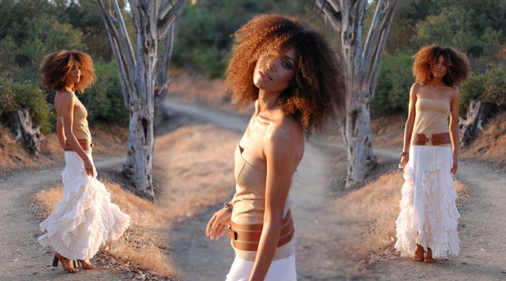 Ndoema sports a vintage ruffle peasant skirt with a strapless suede bustier by Theory, Miu Miu sandals and vintage Adrienne Vittadini wide tan belt.